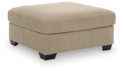 Signature Design by Ashley SimpleJoy oversized accent ottoman in neutral fabric, showing its plush, versatile design for living rooms.
