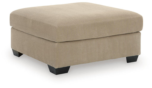 Signature Design by Ashley SimpleJoy oversized accent ottoman in neutral fabric, showing its plush, versatile design for living rooms.