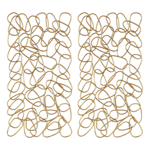 Set of two gold wall art decor pieces by Uttermost, featuring modern circular design for stylish home wall decoration.