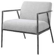 Light gray Brisbane accent chair by Uttermost with a modern design, featuring plush upholstery and sleek wooden legs.