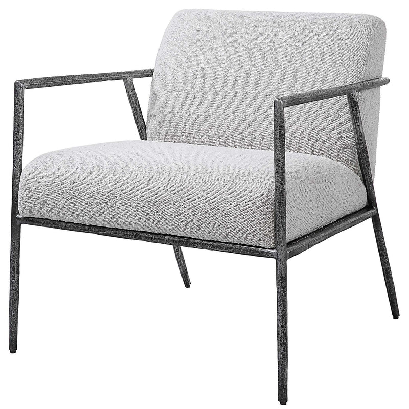 Light gray Brisbane accent chair by Uttermost with a modern design, featuring plush upholstery and sleek wooden legs.