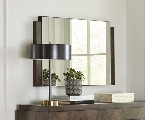Modus Broderick Chesser mirror in Wild Oats Brown with a sleek frame, standing upright on a wooden surface.