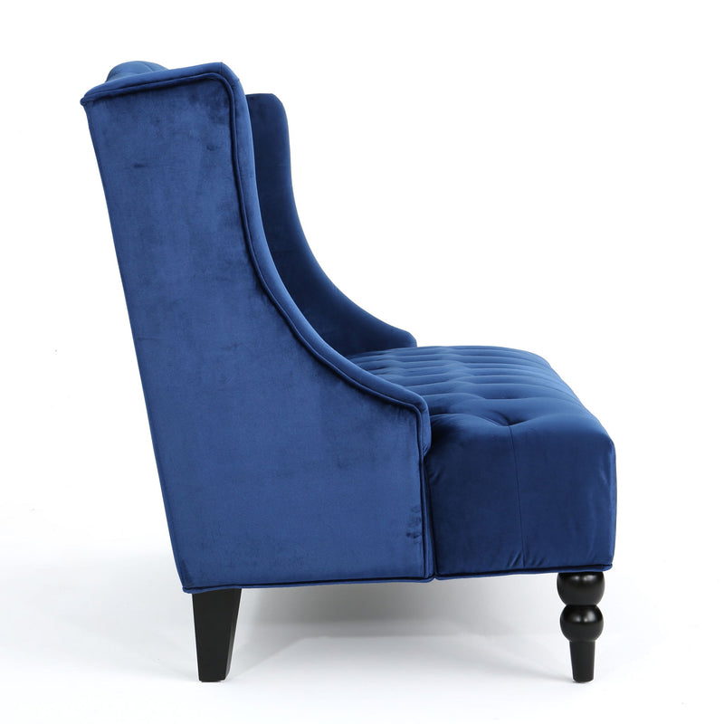 Noble House upholstered loveseat with wing back design and diamond tufting, showcasing plush fabric and elegant craftsmanship.