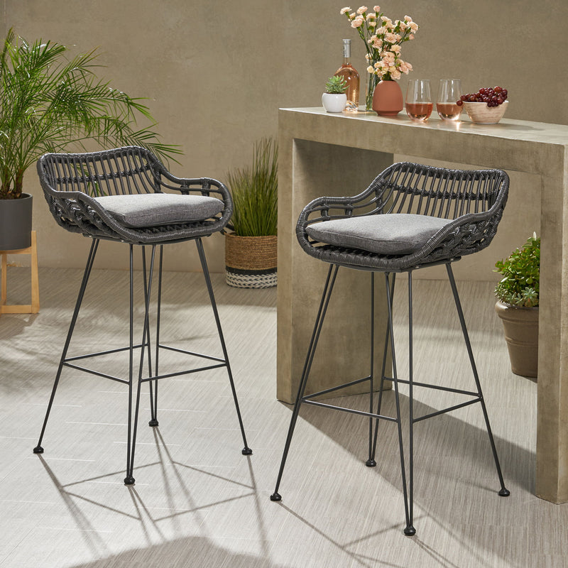 Noble House outdoor rattan bar chair with metal legs, showcasing a stylish stool set for patio or garden seating.
