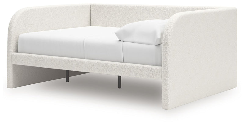 Signature Design by Ashley upholstered Arloster day bed with plush fabric and wooden legs, perfect for versatile living spaces.