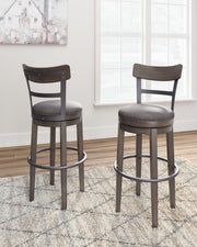 Caitbrook - Tall UPH Swivel Barstool - Gray - R&R Furniture Gallery (Fountain Valley, CA)