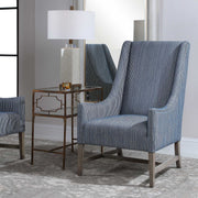 Blue Uttermost Galiot Wingback Accent Chair with tall back and wooden legs, showcasing elegant design and plush upholstery.