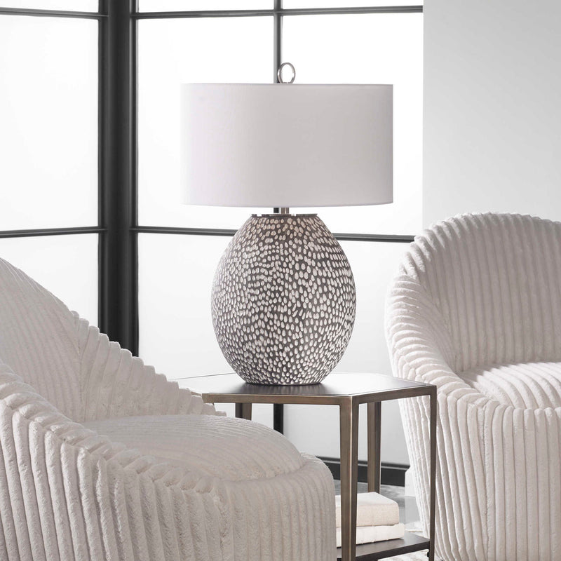 Uttermost Cyprien gray and white table lamp with a modern ceramic base and fabric shade, perfect for contemporary decor.