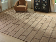 Signature Design by Ashley Orest area rug with intricate patterns and soft texture, ideal for enhancing living room decor.