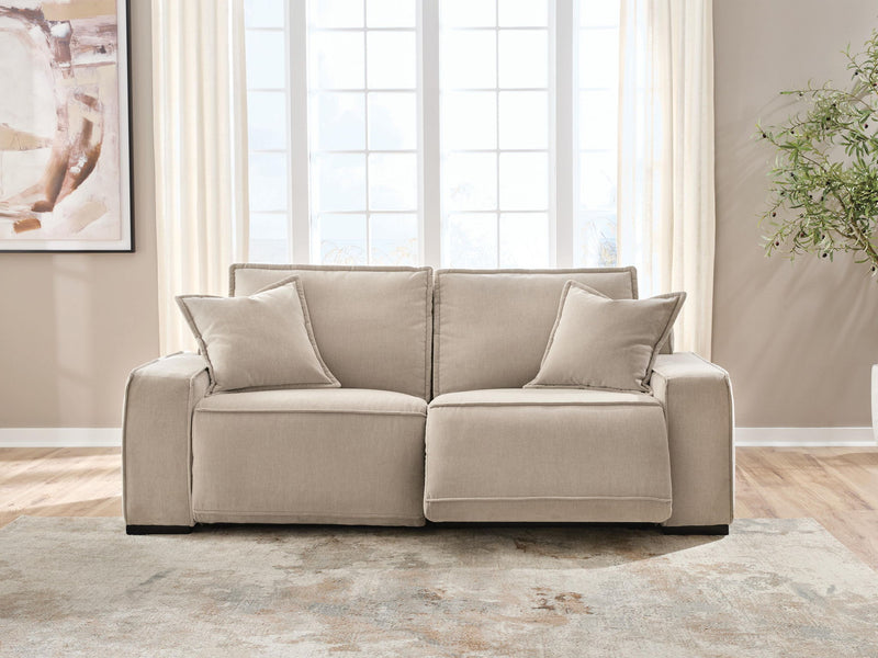 Benchcraft Carceri reclining sectional sofa with plush cushions and multiple reclining seats in a modern living room setting.