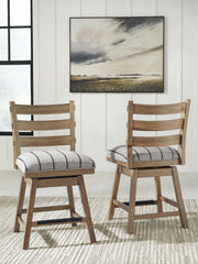 Set of two Benchcraft upholstered swivel barstools by Ridgester with light brown fabric and wooden legs, perfect for kitchen or bar area.