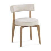 Cream fabric side dining chair by TOV Furniture, Nikita model, with a cushioned seat and sleek modern design.