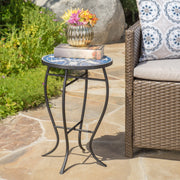 Outdoor round side table with mosaic-style top and curved iron legs in blue and matte black, by Noble House.