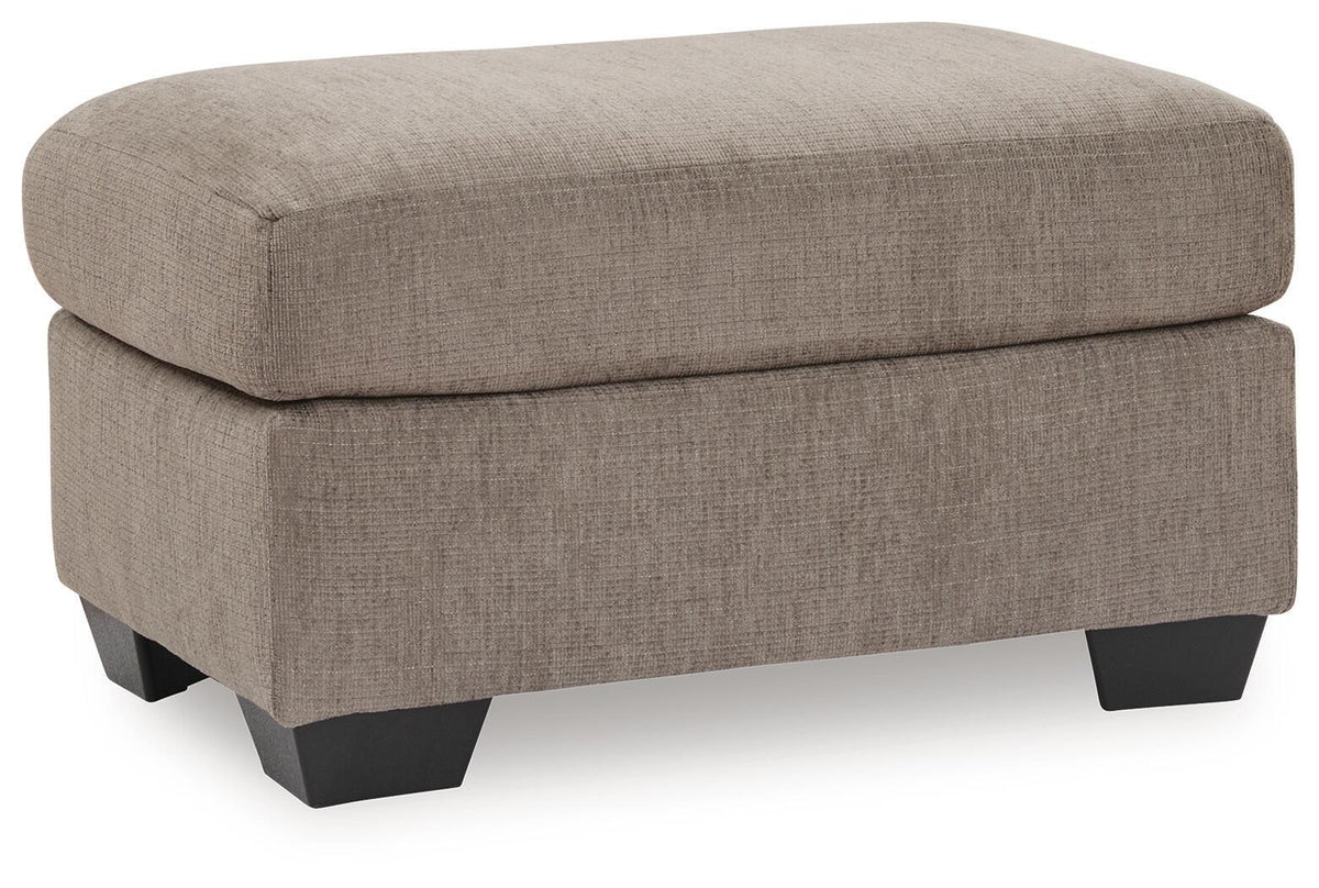 Benchcraft® upholstered Ottoman with plush fabric, featuring a rectangular shape and tufted top for stylish comfort.
