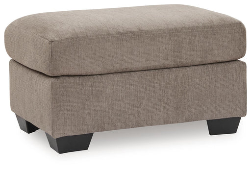 Benchcraft® upholstered Ottoman with plush fabric, featuring a rectangular shape and tufted top for stylish comfort.