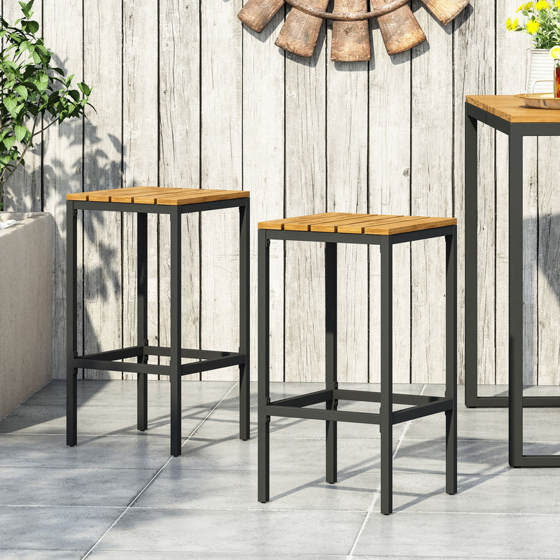 Two Noble House outdoor bar stools with slat wooden seats and metal frames, perfect for patio or backyard seating.