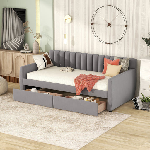 DreamHaus upholstered storage daybed with slat support, featuring a cozy fabric surface and built-in storage drawers underneath.