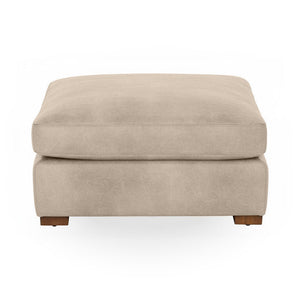 Classic Home Audrey upholstered ottoman with cushioned top and wooden legs, perfect for living room decor.