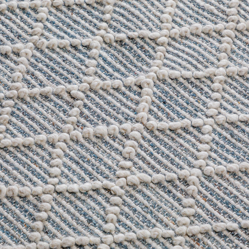Simpli-Home Ogden 6' x 9' ivory area rug with a soft, textured surface and subtle pattern for living room decor.