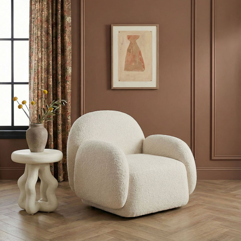 TOV Furniture Marius accent arm chair with plush upholstery and modern design, featuring sleek legs and comfortable seating.
