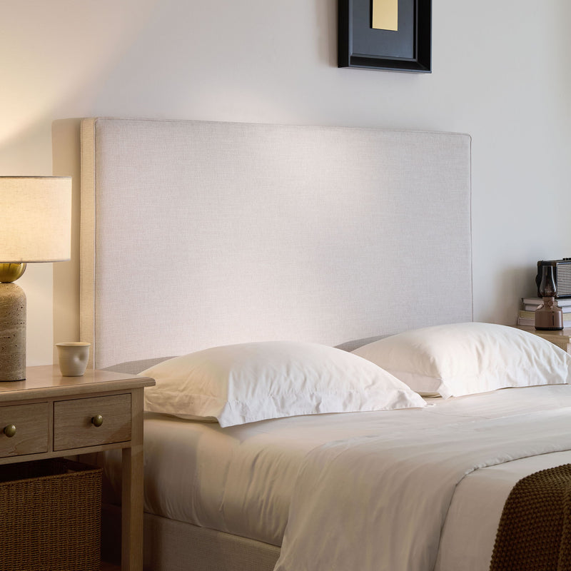 House & Home Furniture Lucas tall upholstered bed headboard in neutral fabric, showcasing a plush, padded design with clean lines.