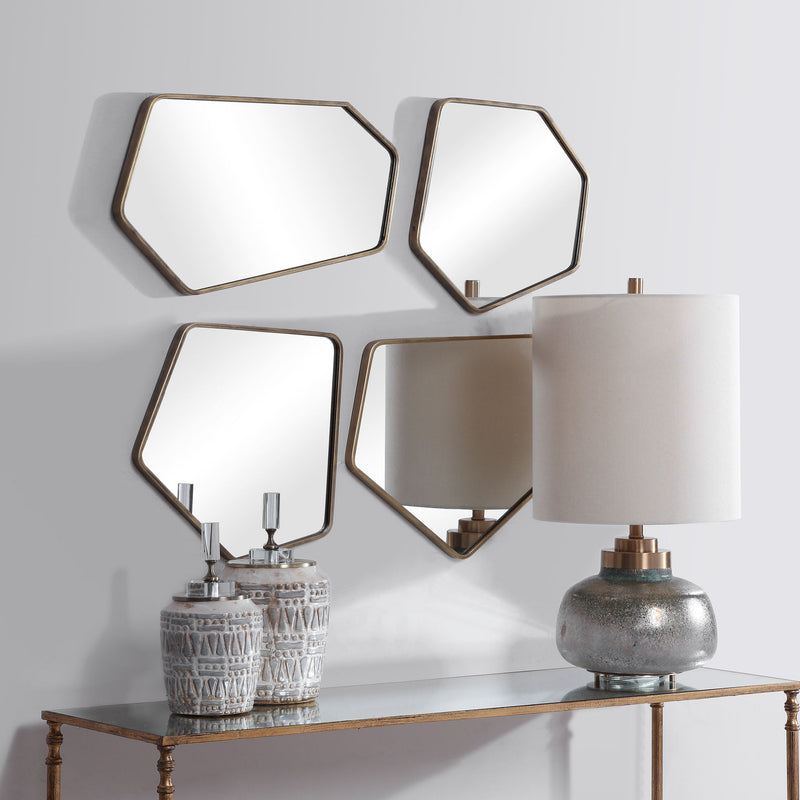 Set of four gold wall mirrors from Uttermost's Linneah Modern Mirrors collection, featuring sleek, round frames for contemporary decor.