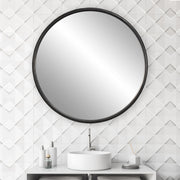 Uttermost Dawsyn round black accent mirror with sleek frame, hanging on a wall in modern decor setting.
