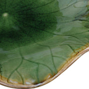 Set of three ceramic wall decor pieces by Uttermost featuring textured, abstract designs for modern interior decoration.