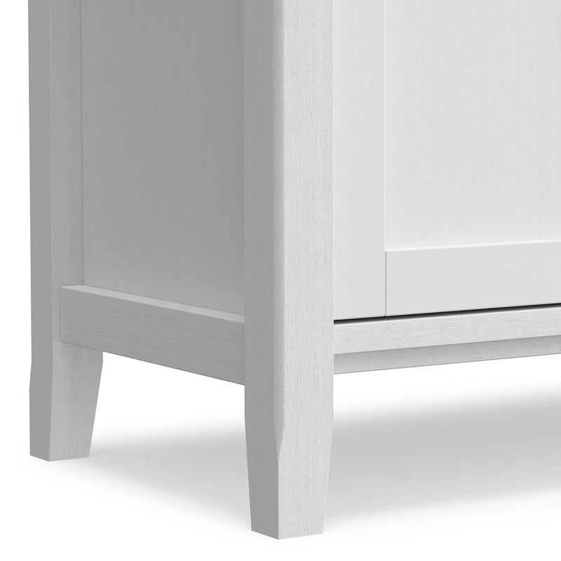 Handcrafted Warm Shaker TV media stand by Simpli-Home with open shelving and cabinet doors, made from warm-toned wood.