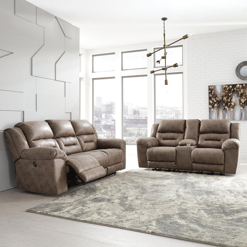 Signature Design by Ashley reclining sofa from Stoneland collection featuring plush cushions and a modern reclining design.