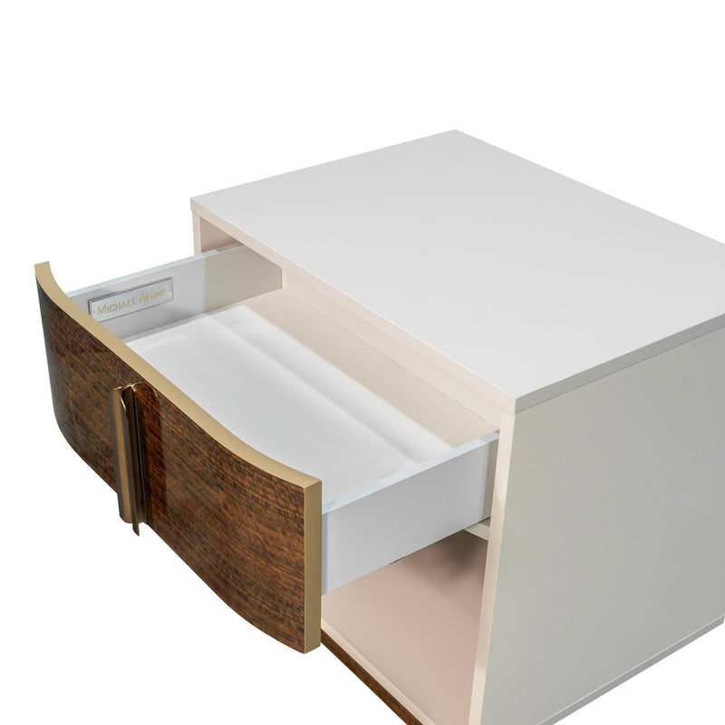 Michael Amini Pavira accent nightstand with a sleek wooden finish and modern design, featuring a single drawer and smooth surface.