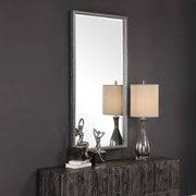 Uttermost Gabelle metallic silver wall mirror with a sleek, round frame, hanging on a modern wall for stylish home decor.
