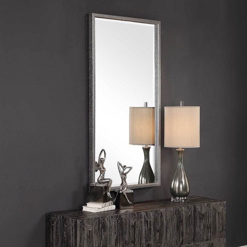 Uttermost Gabelle metallic silver wall mirror with a sleek, round frame, hanging on a modern wall for stylish home decor.