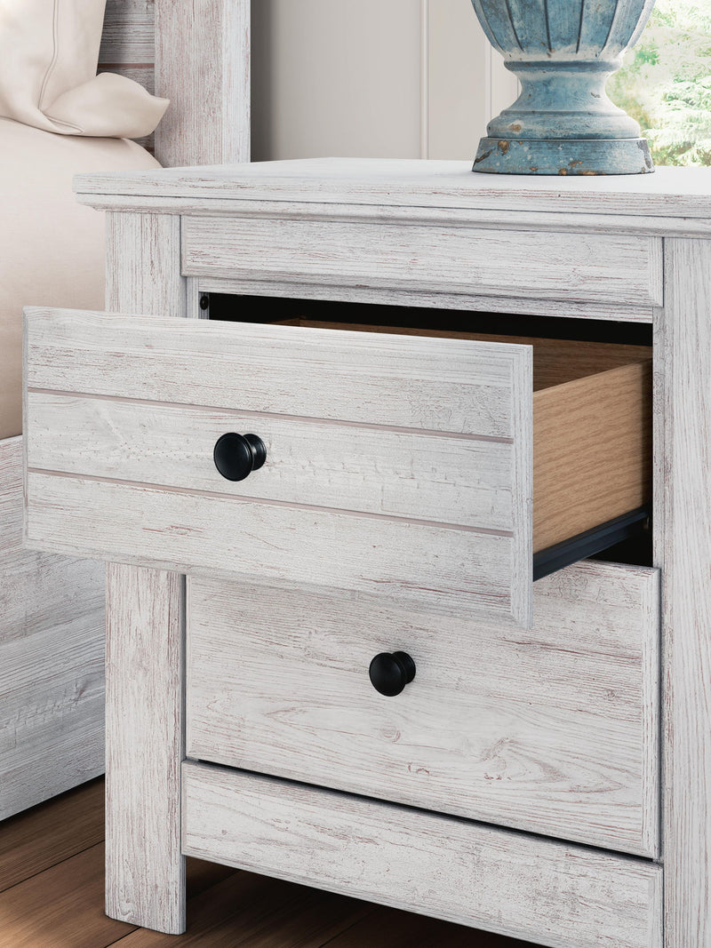 Signature Design by Ashley Makidern two-drawer nightstand with built-in charging station, dark wood finish, and modern design.