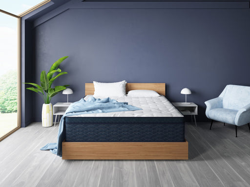 Restonic ComfortCare Hybrid CosmoRest Euro Top mattress with plush surface and supportive layers, shown in a bedroom setting.