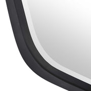 Uttermost Duronia iron wall mirror with a sleek, modern frame reflecting light and enhancing interior decor.