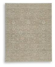 Signature Design by Ashley Neroham area rug with intricate pattern in neutral tones, perfect for living room or bedroom decor.