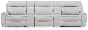 Signature Design by Ashley reclining sectional sofa with plush cushions and reclining features, perfect for relaxing living rooms.