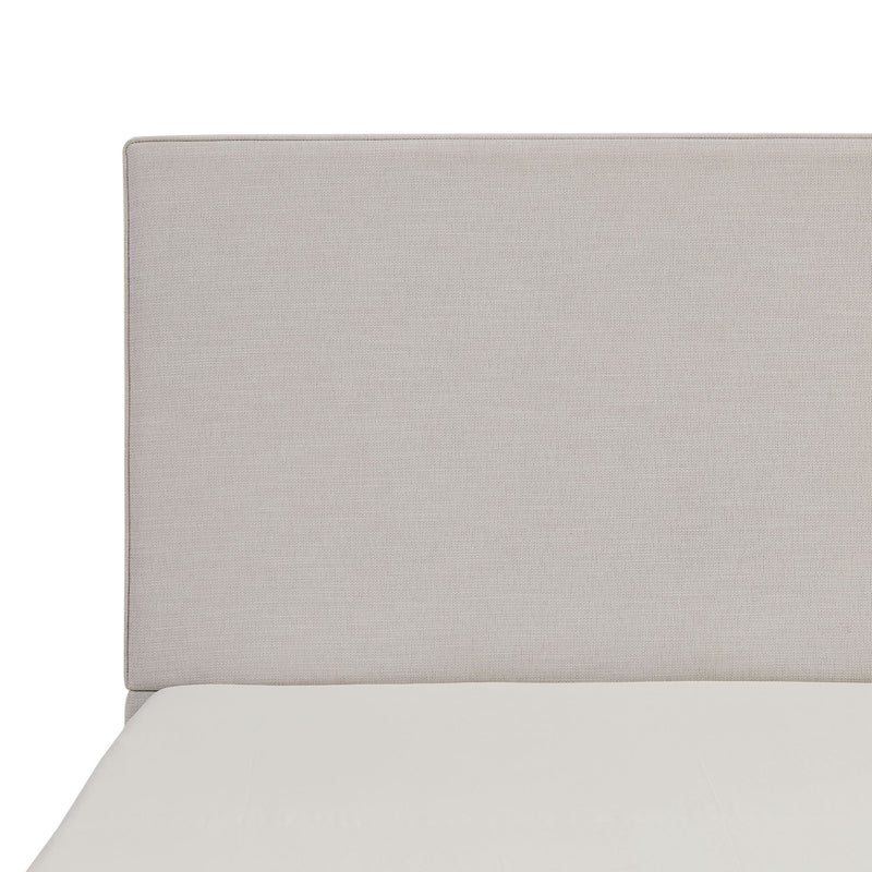 House & Home Furniture Lucas tall upholstered bed headboard with plush fabric and modern design, shown in a bedroom setting.