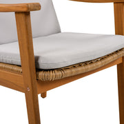 Set of two Noble House outdoor dining chairs with metal frames and cushioned seats for patio or garden use.