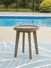 Beige Marina Sun round end table by Signature Design Ashley with a smooth tabletop and modern design, suitable for living room decor.