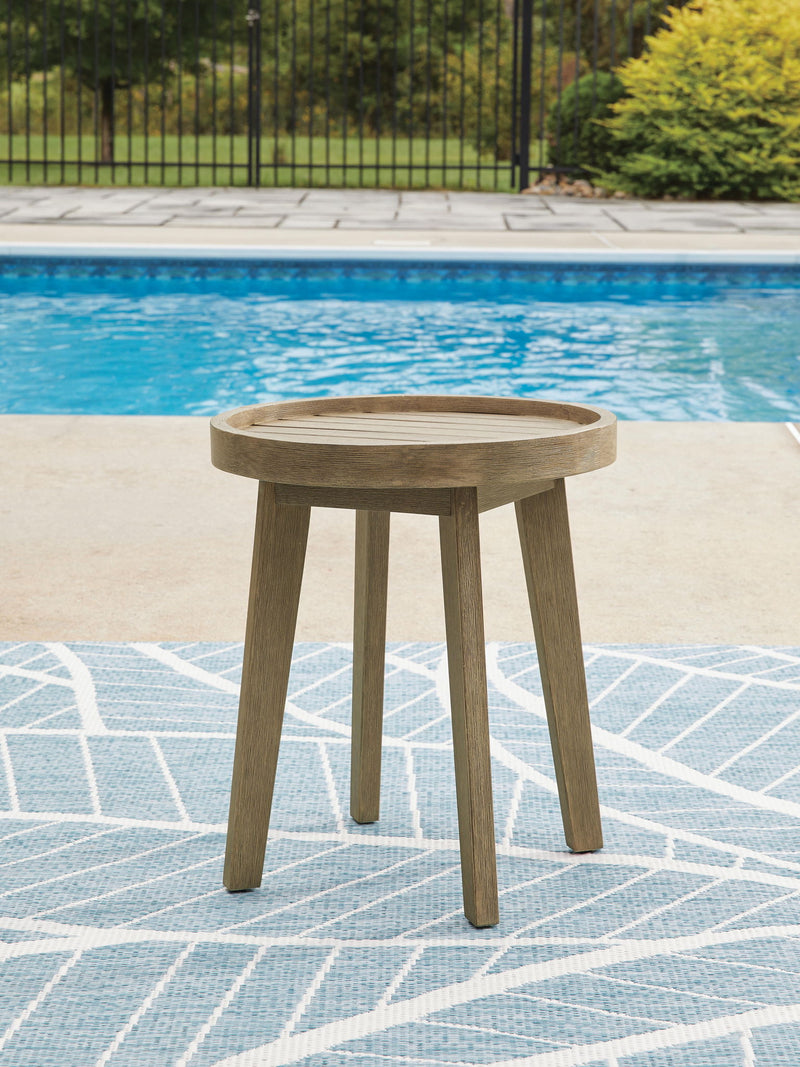 Beige Marina Sun round end table by Signature Design Ashley with a smooth tabletop and modern design, suitable for living room decor.