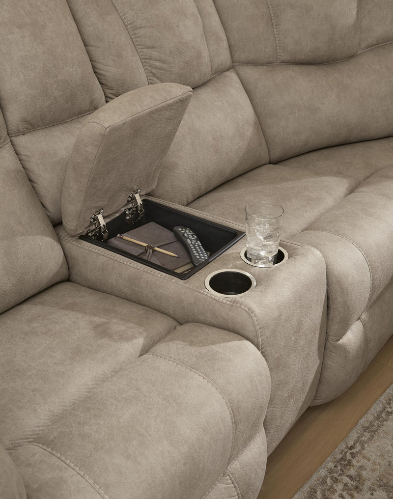 Signature Design by Ashley Pearce-Pike reclining sectional with plush cushions and reclining features, shown in a modern living room setting.