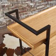 Modern industrial Noble House bar cart with shelving and casters, featuring a sleek metal and wood design for stylish entertaining.