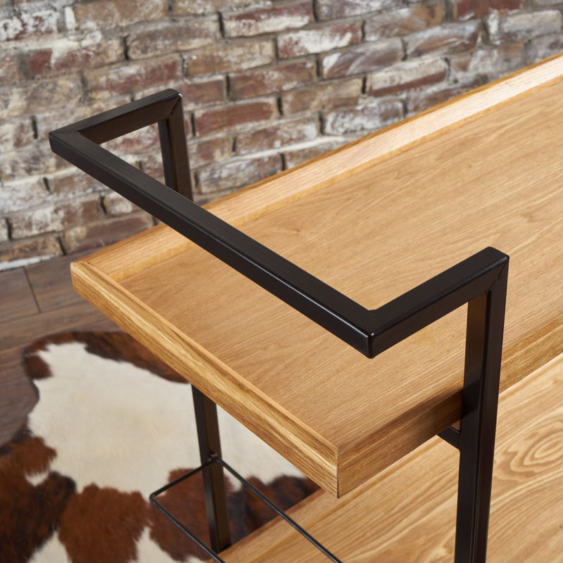 Modern industrial Noble House bar cart with shelving and casters, featuring a sleek metal and wood design for stylish entertaining.