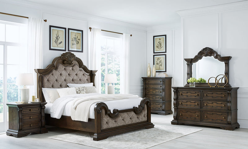 Maylee upholstered 6-piece bedroom set by Signature Design Ashley featuring a bed frame, nightstands, dresser, and mirror in neutral fabric.
