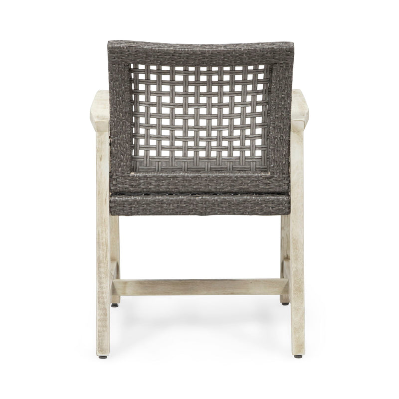 Set of two Noble House outdoor dining chairs with acacia wood frames and woven seats, ideal for patio or garden dining areas.