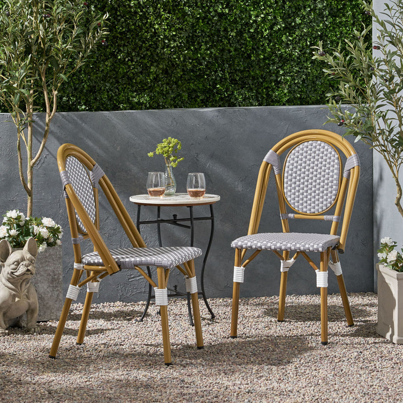 Outdoor rattan and aluminum French bistro chair set by Noble House, featuring stylish and durable seating for outdoor dining.