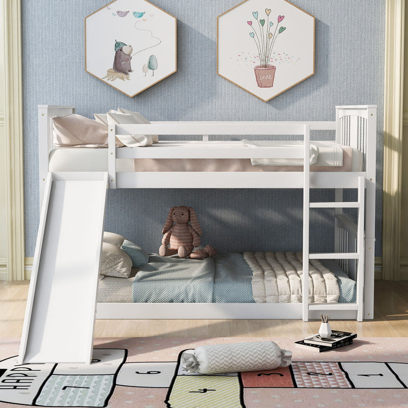 White DreamHaus full over full bunk bed with ladder and slide, showcasing the sturdy frame, ladder, and playful slide in a modern bedroom.