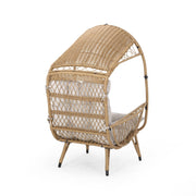 Noble House outdoor wicker standing basket chair with cushion, stylish accent chair for patio or garden seating.